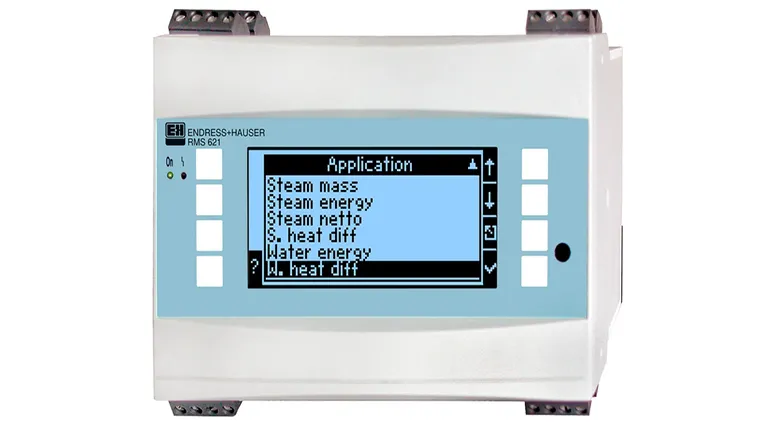 A device with a blue screen and buttons on a white background. Text on the image: "RMS 621" ENDRESS+HAUSER Application: Steam mass Steam energy Steam netto S. heat diff Water energy W. heat diff