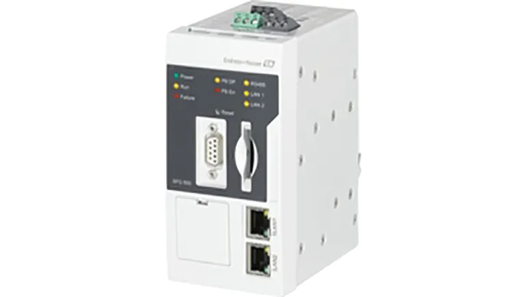 A white and gray electrical device with various connectors, including a USB port, a serial port, and Ethernet ports. The device has a black power cord and an antenna. There is text on the device that says "SFG500 Ethernet/PROFIBUS gateway for remote monitoring.